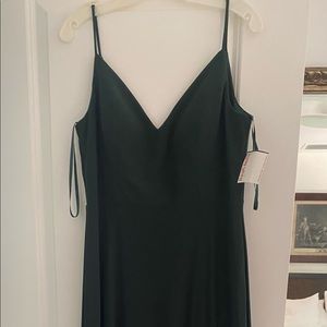 Floor length hunter green David’s Bridal gown.